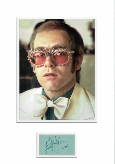 Elton John signed album page