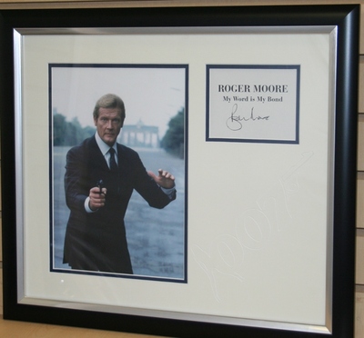 Roger Moore signed book page