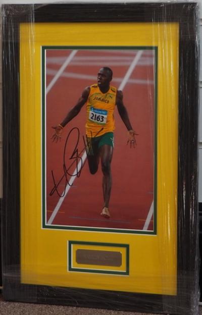 Usain Bolt signed A4 photograph