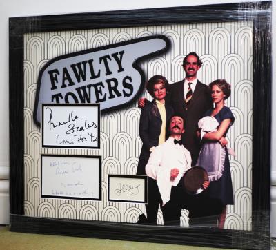 Faulty Towers signed by four